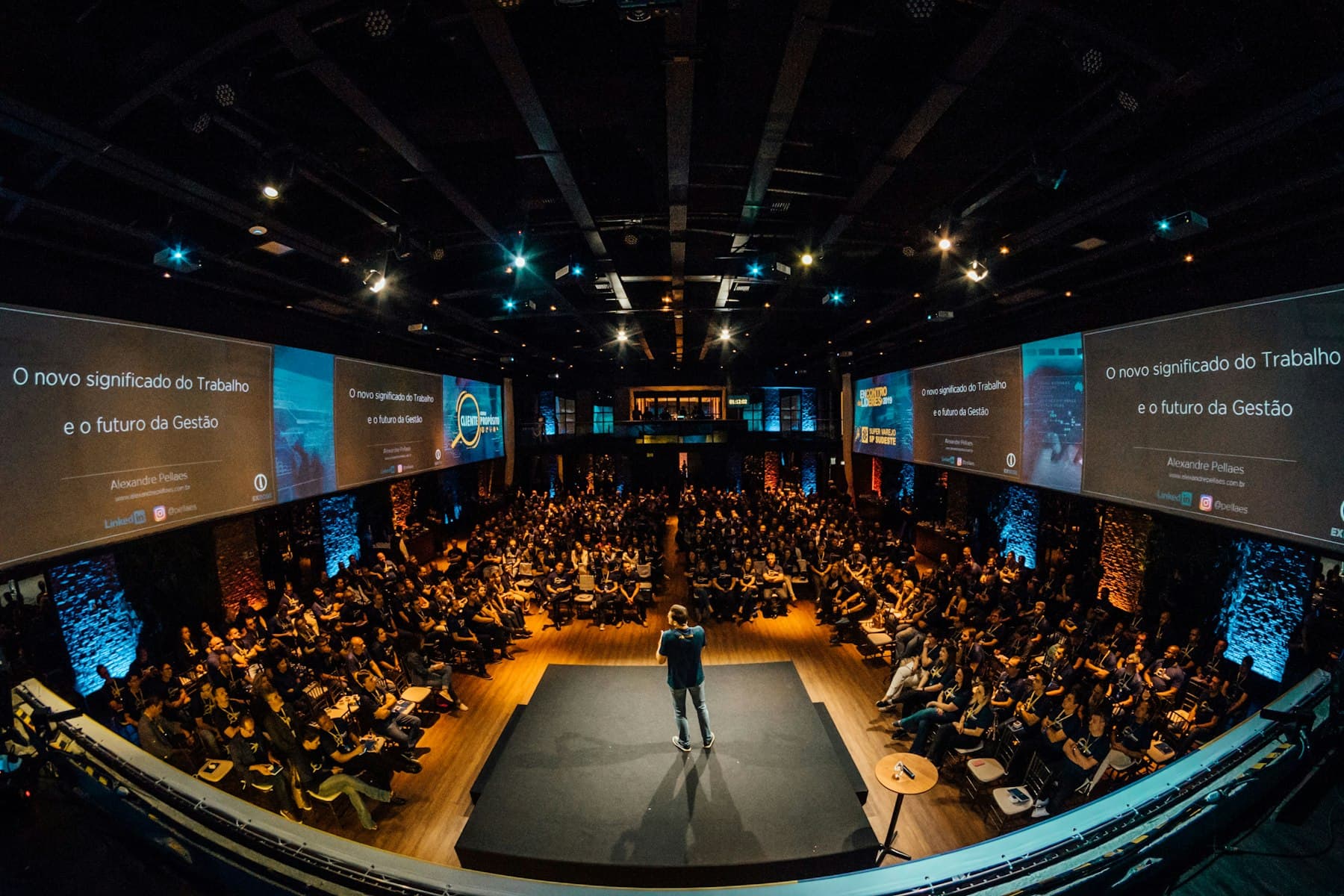 A packed industry event hall during a keynote